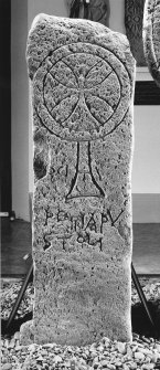 Cross-incised and inscribed slab.