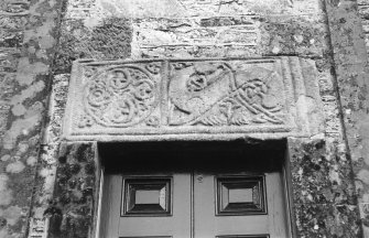 Detail of cross-shaft above door of church