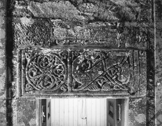 Detail of front of fragment of Anglo-Scandinavian cross-shaft incorporated as lintel over W door.
