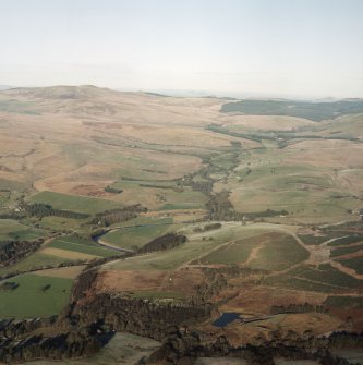 Oblique aerial view of Liddesdale looking along the Liddel Water and Hermitage Water, taken from the SSE.