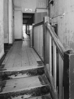 Donibristle airfield, view of top of wooden staircase and corridor within officers' mess.