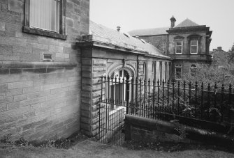 Detailed oblique view from NNW of central part of Pilmuir Street frontage, including side of office building |(right)