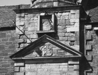 South facade, pediment, detail of heraldic plaque