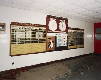 Interior. Detail of 'monthly order' notice boards