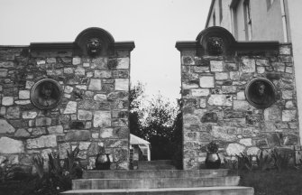 View from south of garden archway in wall to west of house