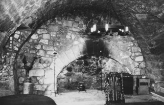 Interior, south wing - view of kitchen fireplace from east