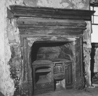 Interior - first floor, north apartment, detail of fireplace in north wall