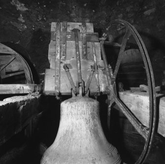Interior -  steeple, belfry, detail of 18th century bell showing headstock and wheel