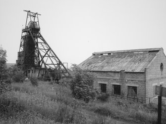 General view of surviving mine headstock, and winding engine house.