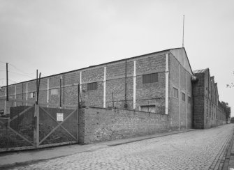 General view of South West corner of works, showing brick-clad erecting shop, with cast-iron uprights