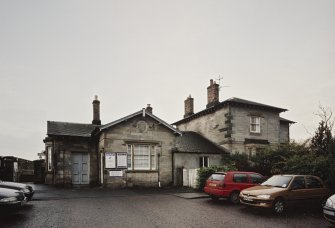 View from WNW showing station house and road level buildings.