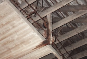 Detail of straw conveyor chain and guide pulleys, photographed 9 May 1994