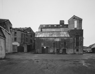 General view from SE of SE end of former distillery