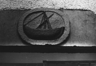 Panel on lintel - boat (painted) over pend. 
[Note: inscribed 'A' and 'E' on surround]