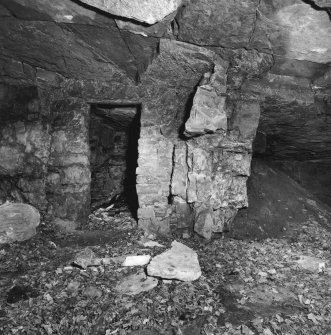 Cults Hill Limestone Quarry.  Interior of entrance area of Limestone Mine, showing watchman's hut at the entrance which has been cut into the rockface.