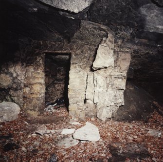 Cults Hill Limestone Quarry.  View of interior of the entrance area of the limestone mine, showing watchman's hut cut into the limestone rockface.