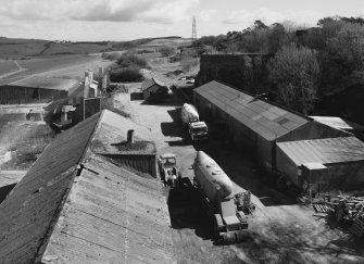 Elevated view from W (at middle level of shaft kilns) of E end of site, including workshops and offices, with old lime kiln (distant right, NO30NE 23.3)