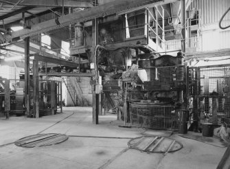 View from NW in brick pressing area, with presses (right and distant left), and bogie track and turntables in foreground