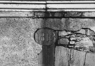 Detail of 1813 date plaque in west wall, above blocked pend