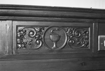 Detail of panelling with snake and chalice (St John)