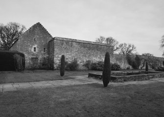 View of stables and tennis court from the South West