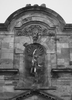 Detail of statue of mercury in shell niche on N front
