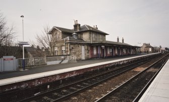 View of N-bound platform and station offices from SE