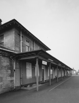 Detailed view from S along N-bound platform showing awning in front of station offices