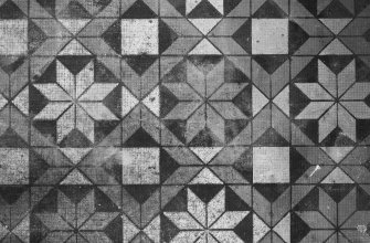 Detail of mosaic tiled floor in office.