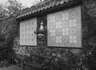 Portuguese tilework on wall adjacent to pond, detail