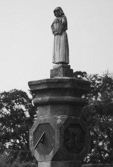 Walled garden, rose garden, sundial capped by small figure, detail