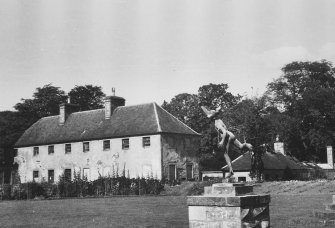 View from south west of east pavilion and statue of Mercury in the garden