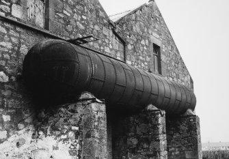 Detail of water tank (former egg end boiler) at East end of maltings range, from East