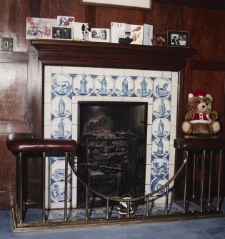 Interior. Detail of fireplace in entrance hallInterior. Detail of fireplace in entrance hall with blue and white figurative tiles