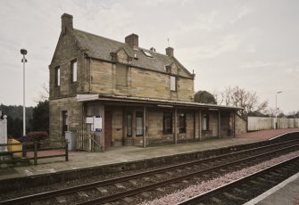 View from N of station offices and house, situated on the S-bound platform on the SE side of the station