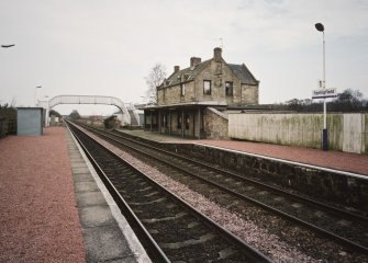 General view from W, showing both platforms, the footbridge, and the station house and offices