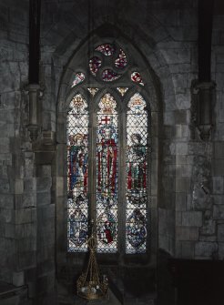 Interior. Stained glass window on S wall