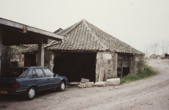 View from SE of horse engine house with waterwheel house on left side
Photographed 9 May 1994