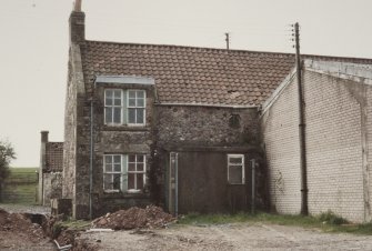 View from SE of dwelling at S end of E leg of range
Photographed 9 May 1994