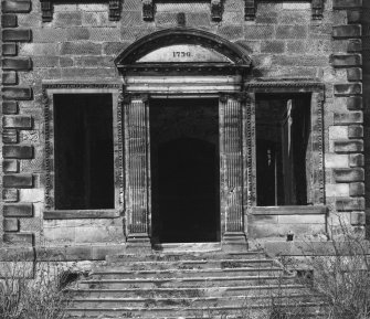 South elevation - main door and flanking windows