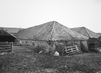 View from S of central block of steading, showing S end of covered cattle court