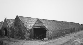 View from S of E corner of main block of steading, containing former Turnip Sheds and Byre (centre of the 3 bays)