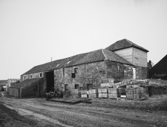 View from W of NW side of main block of steading, containing former corn and straw barns
