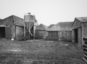 View from NE of NE side of main block of steading, containing cattle courts