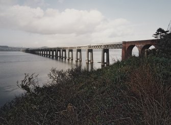 General view of west side of bridge from SSW, with first arches of red-brick viaduct visible (right)