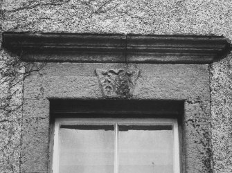 Detail of carved lintel and cornice above first floor window from South.