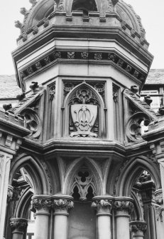 Detail of heraldic panel and decorative stonework.
