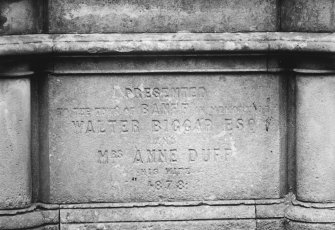 Detail of inscription 'Presented To The Town Of Banff In Memoriam Of Walter Biggar Esq and Mrs Anne Duff His  Wife. 1878' on base of fountain.