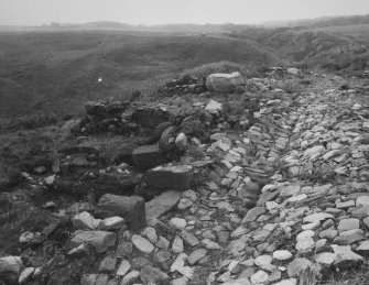 View from North-East showing excavation of medieval castle courtyard with drain and entrance to kitchen (with ovens).