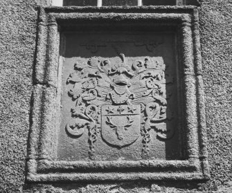 Detail of heraldic panel above main entrance doorway.